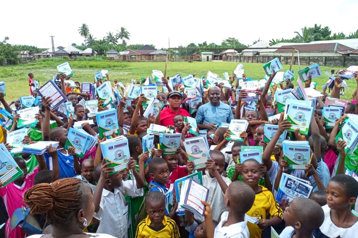 primary school students as they received notebooks for the ovu foundation emplowerment