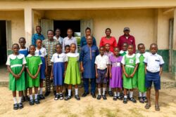 School group portrait in front of school building-ovu-foundation